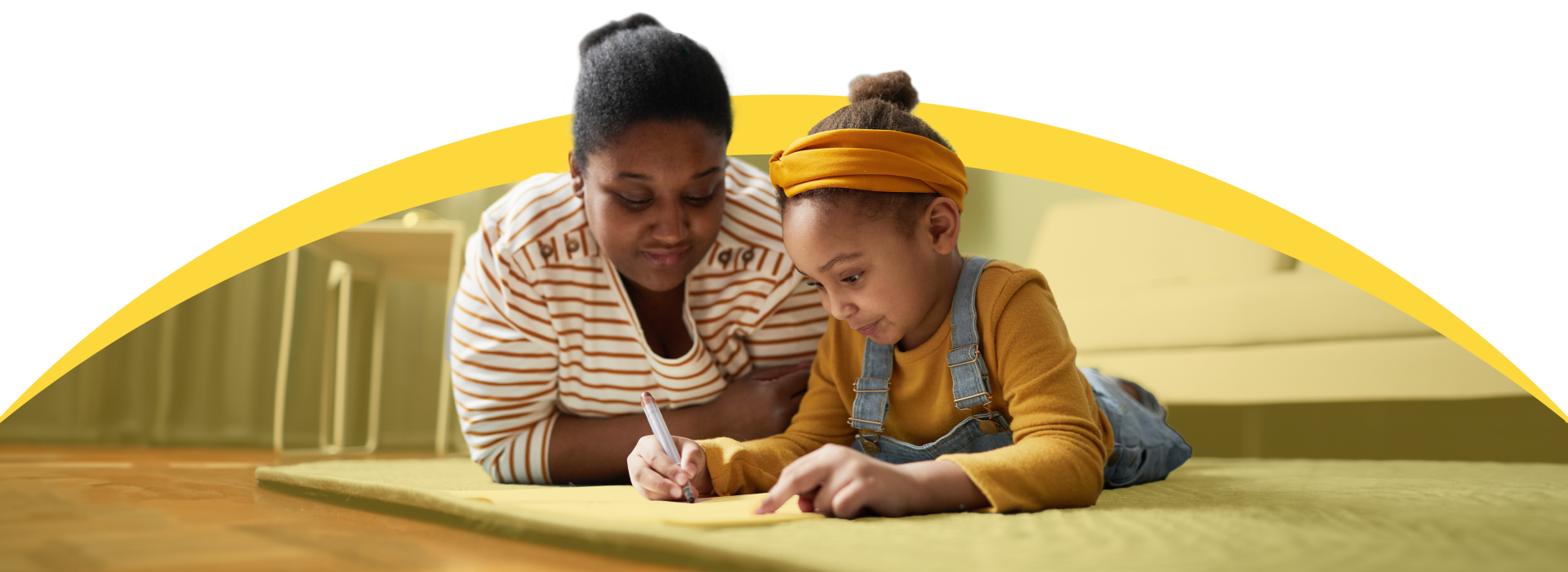 Mother helping daughter with homework