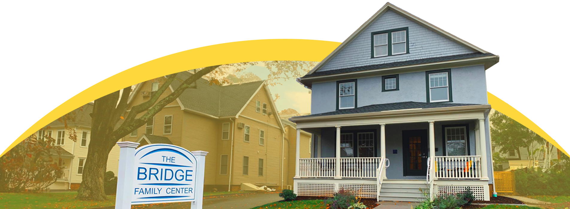 The Bridge Family Center employees sitting on grass