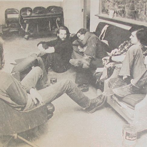 Group of males sitting in circle