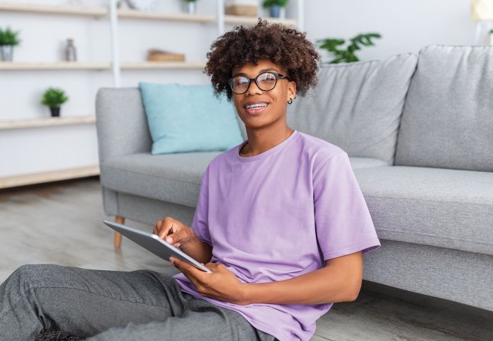 Teenager using iPad