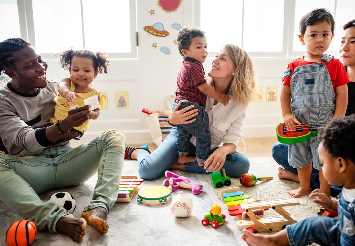 Children with parents playing with toys