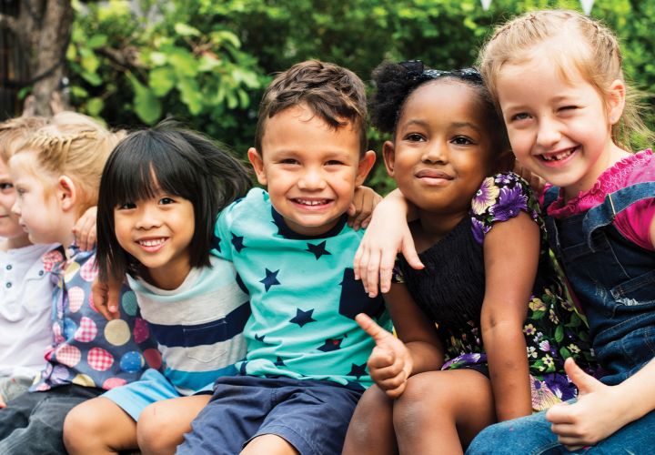 Children with arms around each other