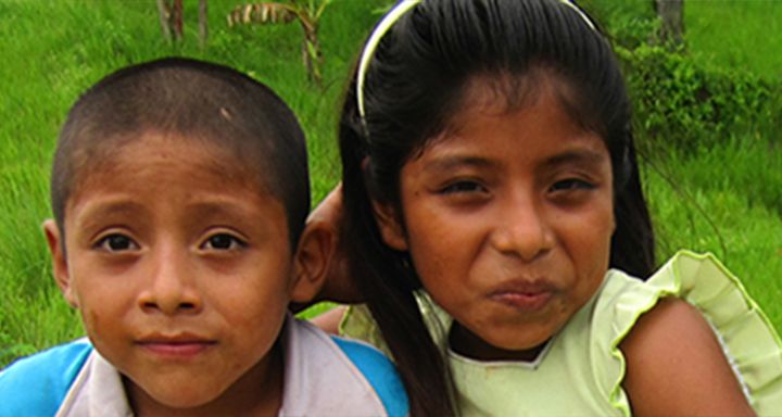 Two children leaning on eachother