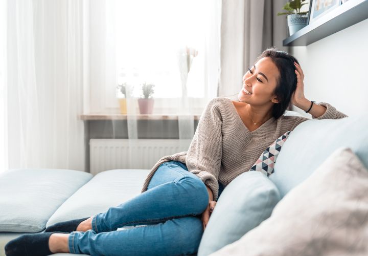 Woman sitting on couch