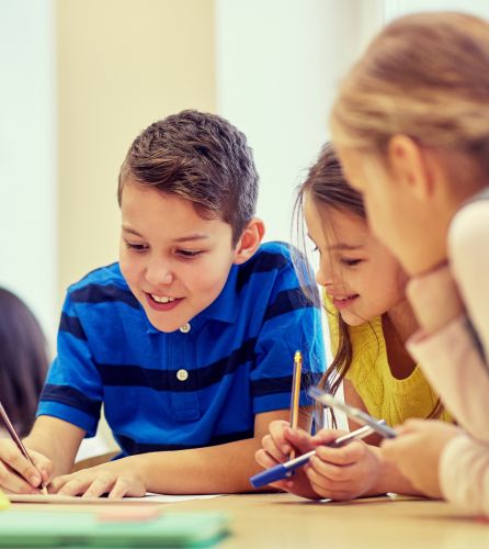 Children collaborating on school work 