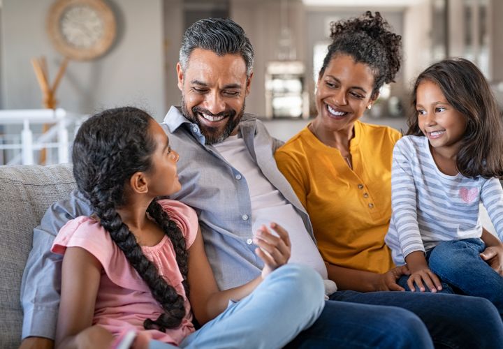 Family sitting on couch