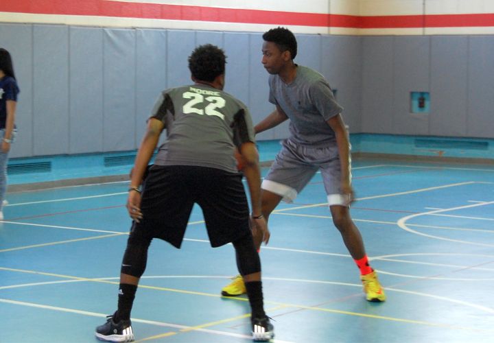 Teens playing basketball