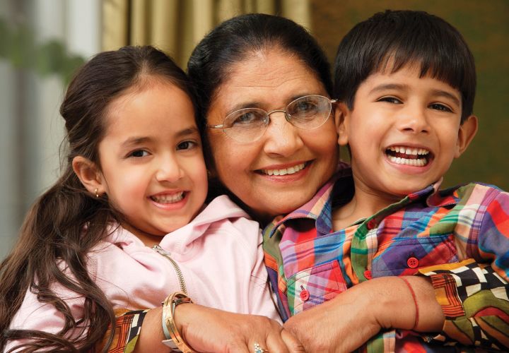 Grandmother hugging grandchildren