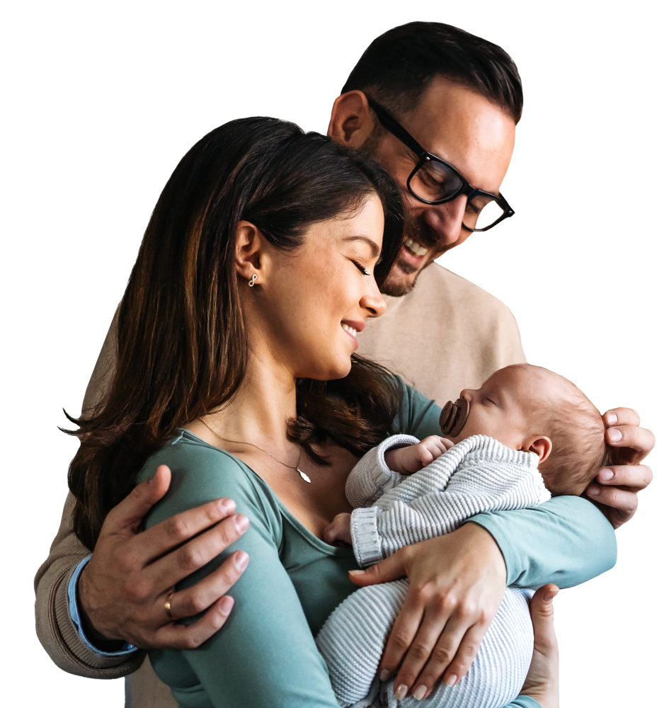 Couple holding their sleeping baby